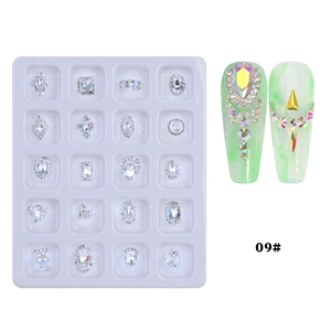 Macro view of 20-grid nail art crystal charms with heart and cross alloy details