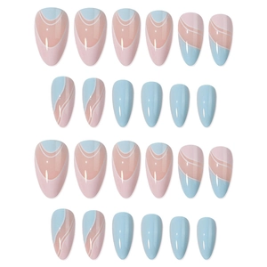 Almond-shaped press-on nails with blue wave patterns and pink French tips on white background