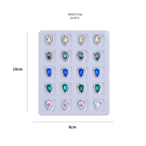 Set of 20 teardrop crystal nail charms in five vibrant colors with mini diamond borders