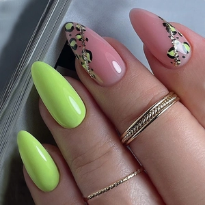 French leopard print press-on nails with neon green accents and almond shape design