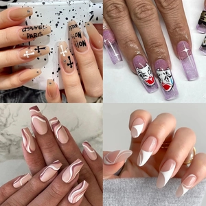 Variety of long coffin and stiletto press-on nails with purple glitter and hand-painted art
