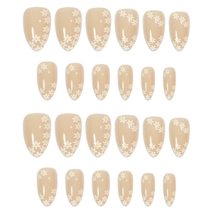 Glossy oval press-on nails with nude pink base and white daisy floral patterns