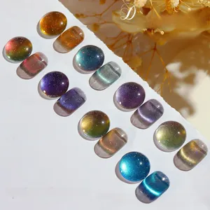 Macro shot of dynamic cat eye nail polish swatches in galaxy colors with glitter effects