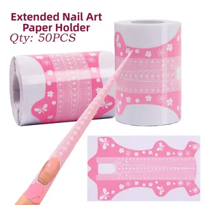 Macro view of long pink nail extension forms with butterfly pattern and scale guide