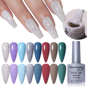 Macro detail of quail egg effect gel nail polish set with sand grain speckles and matte finish