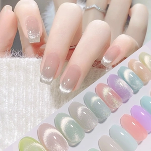 Detailed palette of magnetic cat-eye nail polish in silver, pink, and mint green shades