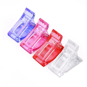 Transparent plastic nail clips set in purple, pink, and red for extension gel shaping