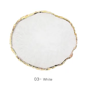 Detailed view of white resin agate palette with gold foil edge and marble texture