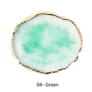 Macro shot of green resin agate palette with hammer-textured golden metallic rim