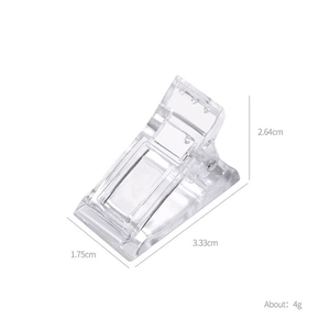 Detailed view of clear nail extension clip showing dimensions 3.33cm by 2.64cm