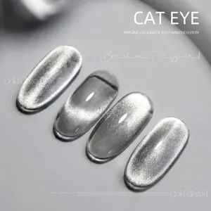 Macro shot of silver gray cat eye nail art tips with sparkling magnetic crystal effect
