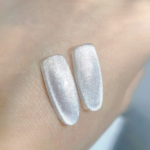 Sparkling silver cat eye magnetic nail polish gel on long oval shaped nails