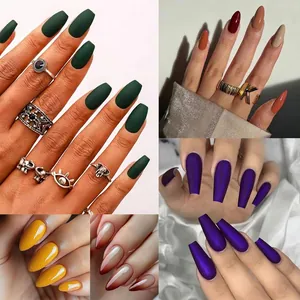 Collection of matte and glossy press-on nails in various shapes and colors with rings