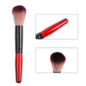 Red makeup dust brush for nails with soft synthetic bristles and metallic black ferrule