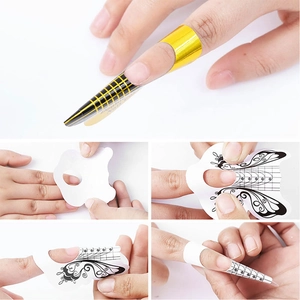 Detail showing the application of professional nail extension forms with precise grid lines