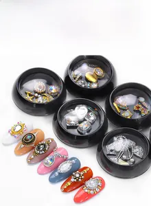 Macro view of crystal nail art rhinestones set with teardrop shapes in a storage jar
