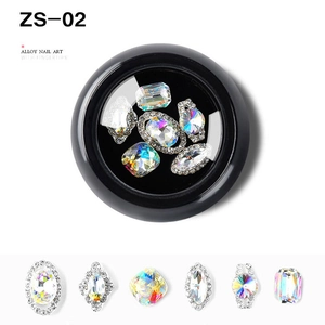 Detailed macro view of mixed alloy nail art charms with colorful rhinestones in a kit