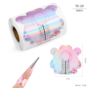 Detail of holographic nail extension forms with pink floral patterns and numbered scales