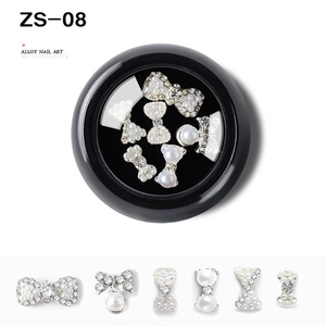 Detail of alloy nail art charms with pearls and rhinestones in various bow designs