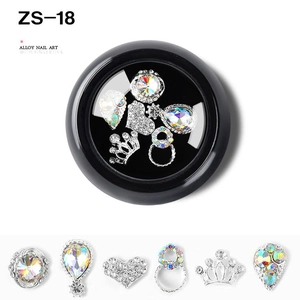 Close-up of alloy nail art charms with sparkling zircons in various geometric shapes