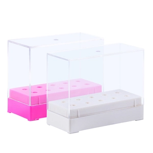 Close-up of 10-hole transparent nail drill bit organizer boxes in pink and white
