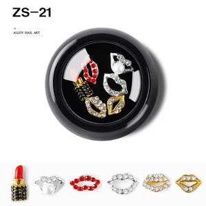 Detailed close-up of alloy nail charms with rhinestones in lip and lipstick shapes