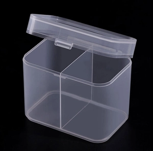 Detail of dual-compartment clear plastic organizer box for cotton pads and swabs