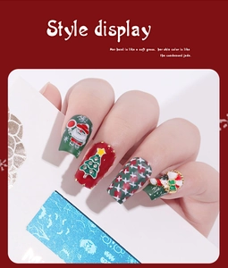 Macro detail of Christmas themed press-on nails with Santa Claus and rhinestone decor