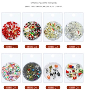 Detailed set of Christmas and Halloween nail art charms including snowflakes and pumpkins