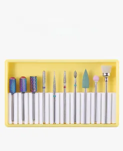Detailed 10-piece nail drill bit set with ceramic and alloy tips in a yellow storage case