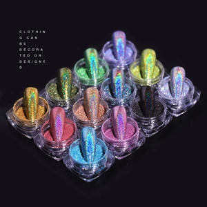 12-color holographic nail laser powder set with sample tips on a sleek black background
