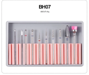 Detailed 10pcs ceramic and alloy nail drill bits set with pink brush in plastic case