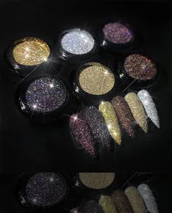 Macro detail of six-color crystal diamond nail powder set with shimmering swatches