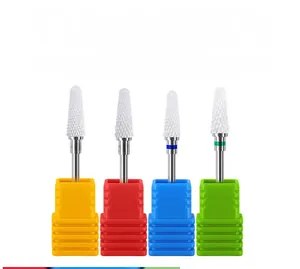 Detail of professional ceramic nail drill bits with color-coded bases for manicure