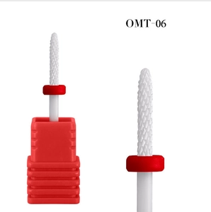Macro detail of OMT-06 ceramic nail drill bit with professional red dust ring and storage box