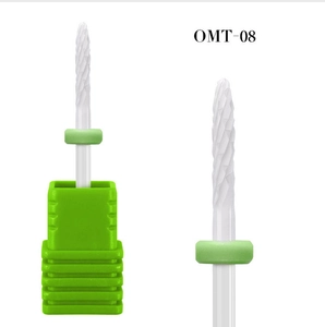 Detailed macro view of white ceramic nail drill bit OMT-08 with green base for manicure