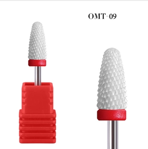 Macro detail of OMT-09 white ceramic nail drill bit with cylindrical round head and red ring