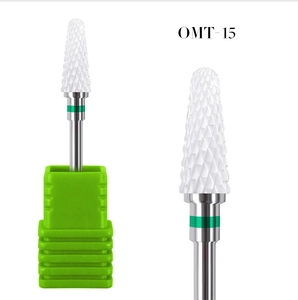 Macro detail of OMT-15 ceramic nail drill bit with white cylinder head and green ring