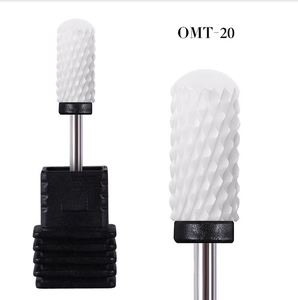 Macro detail of OMT-20 ceramic nail drill bit with fine cross-cut teeth and round corn tip