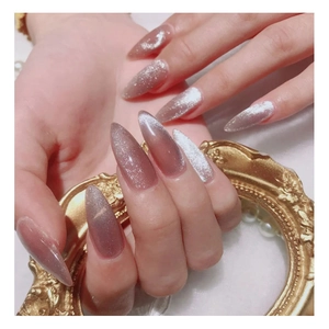 Long almond cat eye press-on nails with brown gradient and silver glitter shimmer