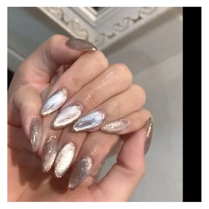 Champagne gold cat eye nail art design on long oval nails with shiny glitter effect