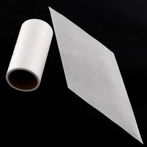 White lint roller refill roll with diamond-shaped peel-off sticky sheet on black background