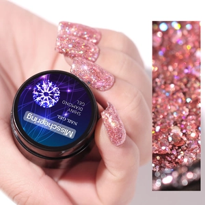 Λαμπερό ροζ μωβ glitter τζελ νυχιών με εφέ διαμαντιού σε μαύρο βάζο με δείγμα