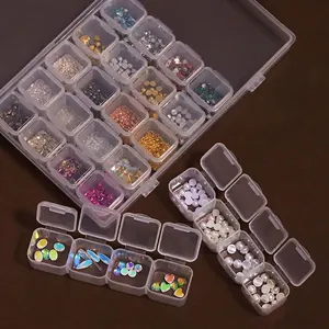 Transparent 28-slot plastic nail art storage box with pearls and rhinestones organizer