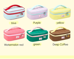 Collage of quilted makeup bags in six vibrant colors with floral charms and handles