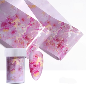 Pink marble nail transfer foil with gold ink smoke effect in clear storage jar