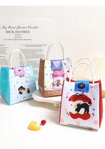 Three cartoon animal print insulated lunch bags with secure velcro and rope handles