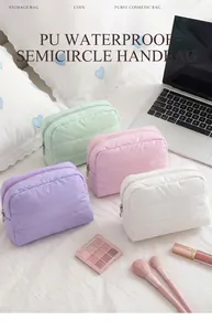 Detailed view of semi-circular quilted waterproof PU makeup bags in pastel colors