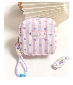 Pink and white striped canvas pouch with blue heart print and purple zipper strap