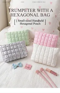 Quilted cosmetic bags in pastel colors with gold zippers on white bedding set